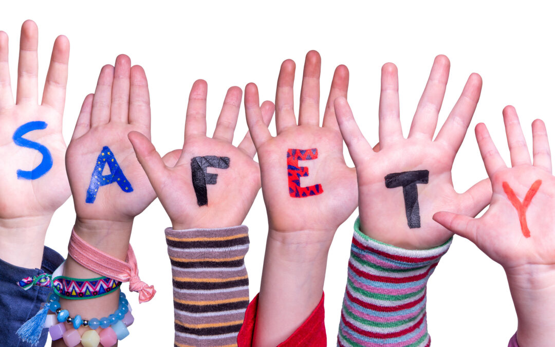 Children hands spelling out the word "Safety" to represent online safety