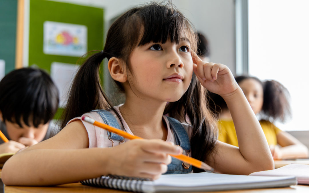 Young student at school desk practicing computational thinking algorithmic thinking and design thinking skills