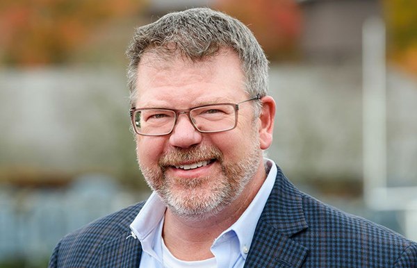 Keith Oelrich with Learning.com looking at camera and smiling