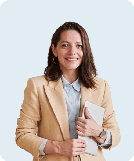 Female teacher in business suit holding tablet used for AI curriculum and looking at camera and smiling