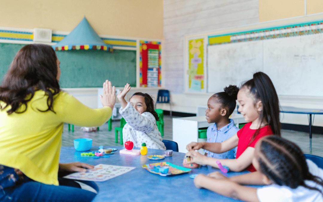 Students and teacher playing game together